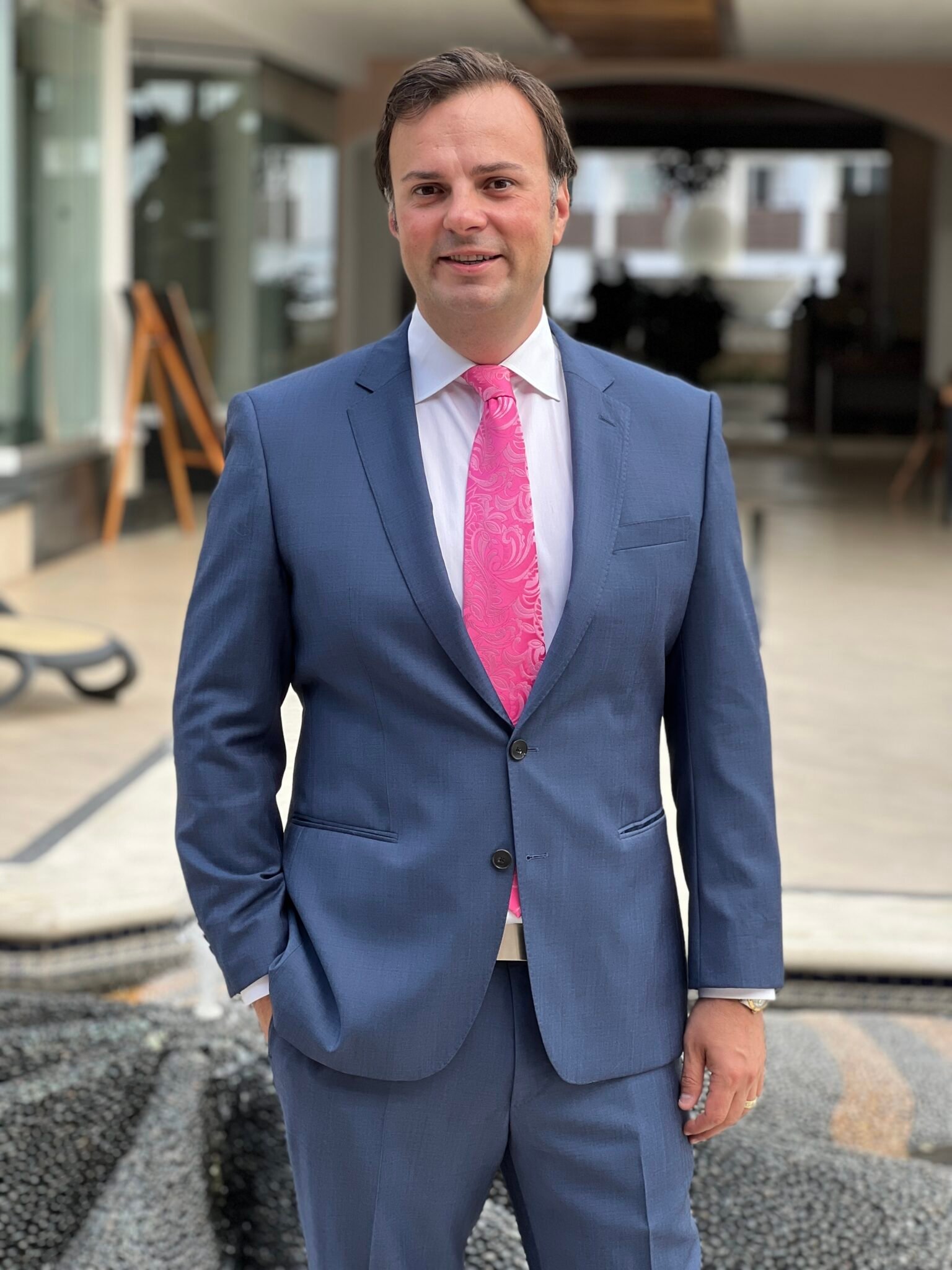 Danny Milea, owner of JobsDriven, in a blue suit standing outdoors